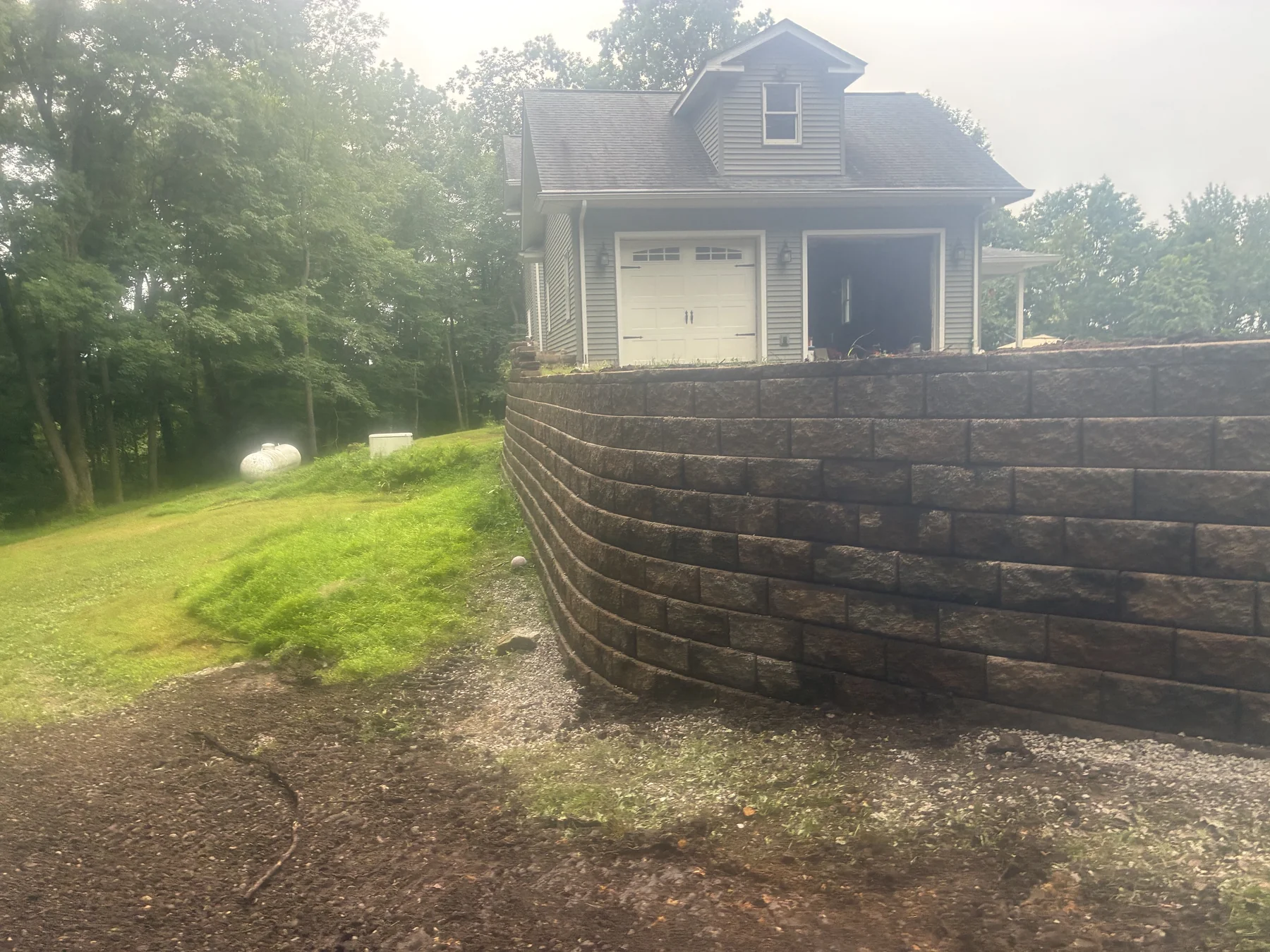 Block retaining wall and landscaped property in progress